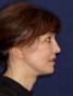 a woman with brown hair and a ponytail