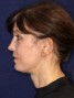 a woman with brown hair and a ponytail